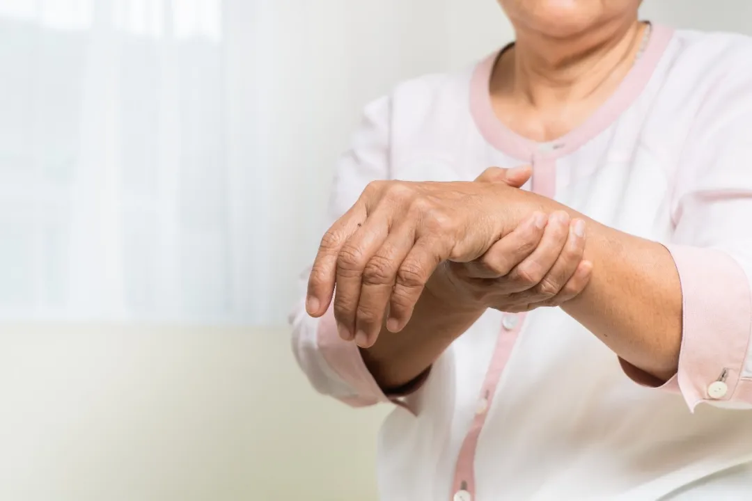 Older adult experiencing persistent post-shingles nerve pain