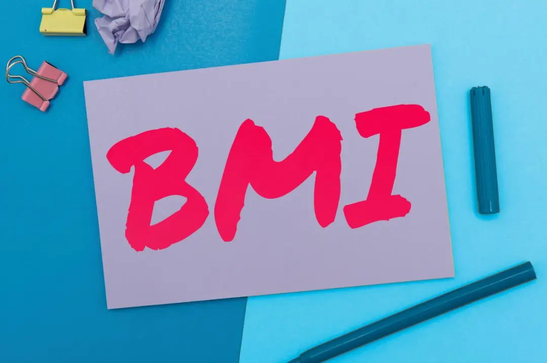 BMI written on a card — body mass index is the starting point for metabolic health assessment